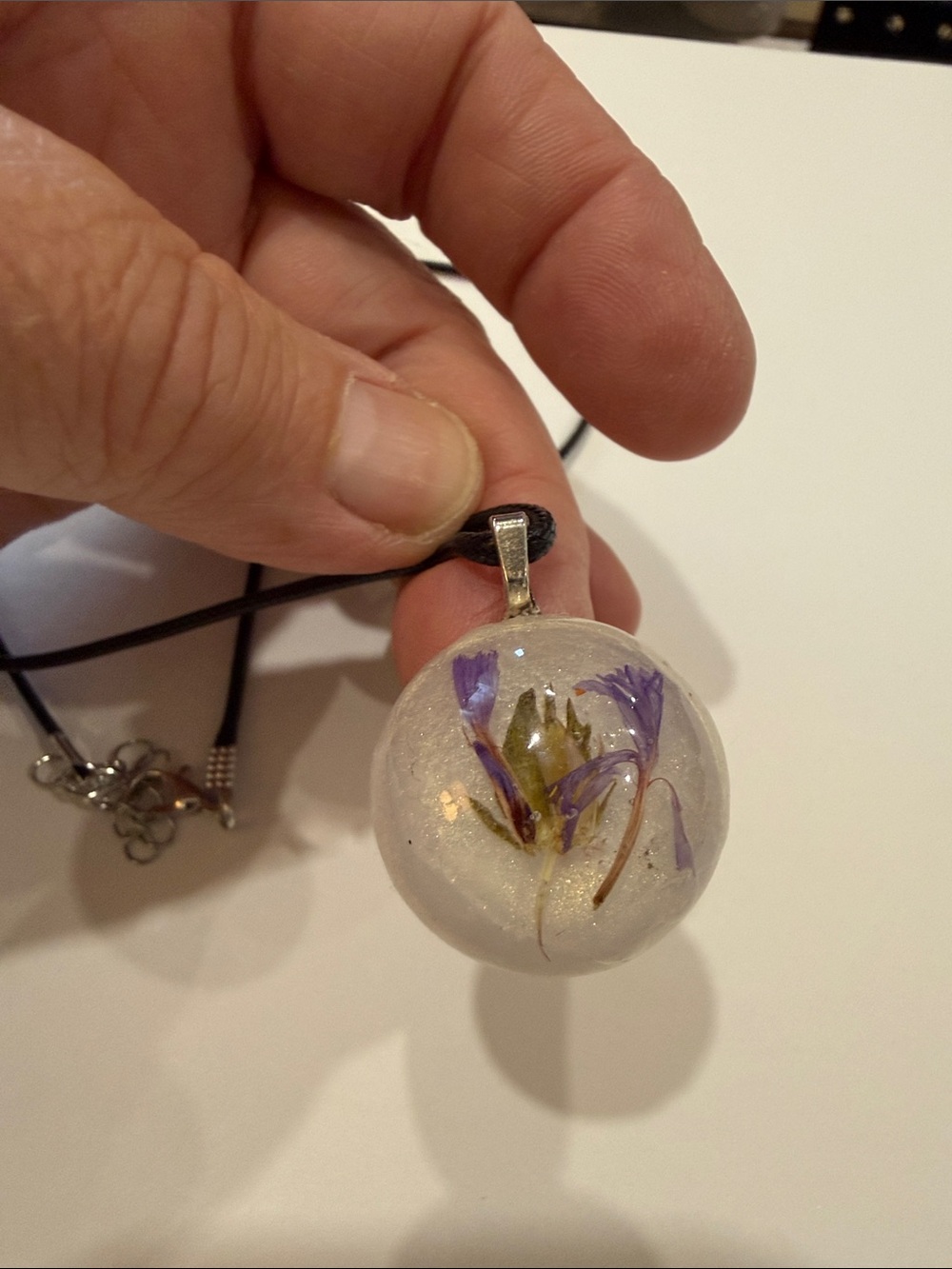 Resin Pendant Necklace with Pressed Purple Flowers on Black Cord
